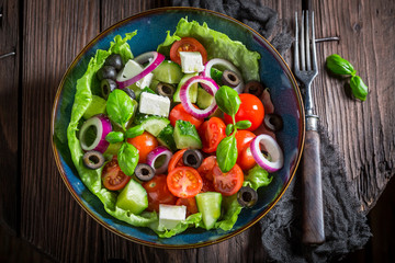 Delicious Greek salad with cherry tomatoes, lettuce and onion