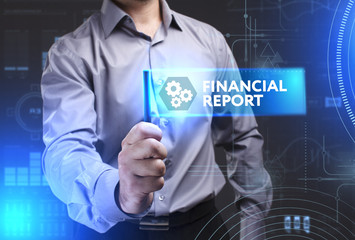 Business, Technology, Internet and network concept. Young businessman showing a word in a virtual tablet of the future: Financial report
