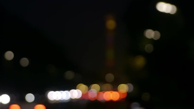 Bokeh Focus Pull to Berlin Monument Victory Column at Night, At the start of the clip you can see a wonderfull bokeh, with totally round circles. Here we have the Siegessaule with rainbow colors.