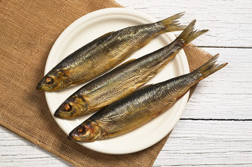 Smoked fish in plate