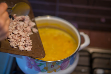 Soup with pumpkin, potatoes, cream, cheese and chicken. First course.