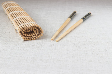 Sushi chopsticks with rolled bamboo straw mat