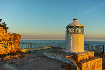 Fototapeta na wymiar Sunset over Lighthouse in Kavala, East Macedonia and Thrace, Greece
