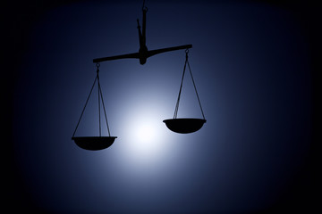 justice scale silhouette on dark background