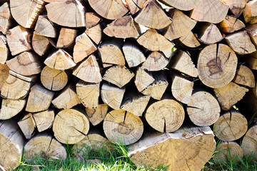 Stack of brown wooden log background