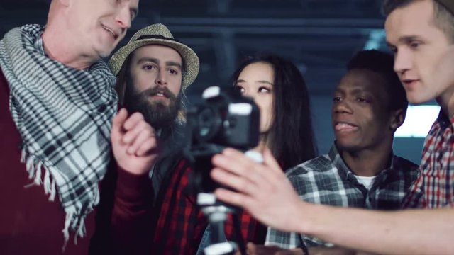 The diverse students learning how to work with the camera in studio.