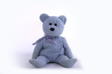 blue teddy bear on white background.