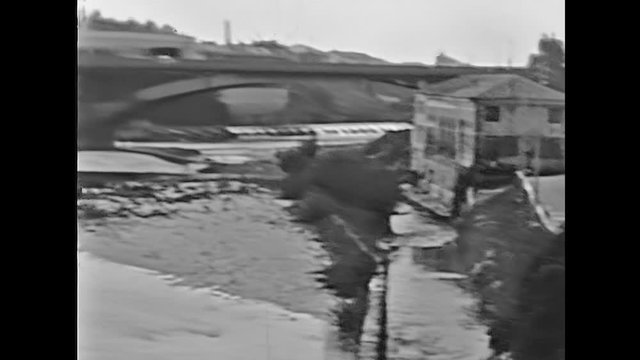 The historical Vittoria new bridge or Ponte Nuovo of Bassano del Grappa town in Italy on Brenta river. Historical 1960 footage.