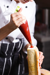 female hands holding piping bag