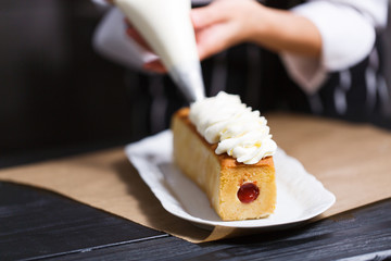 female hands holding piping bag