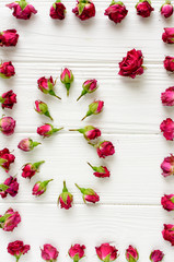 Flowers composition. Pink roses on white wooden background