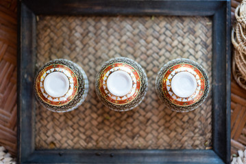 Asian tea cups on bamboo tray, overhead view. Asian hospitality concept