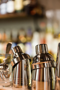 Closeup of cocktail shaker on bar counter, selective focus