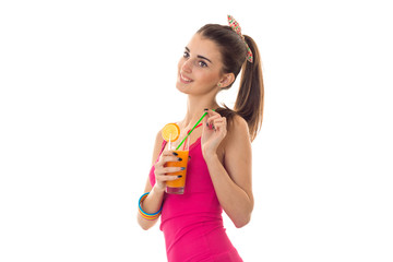 happy young lady with dark hair in pink summer shirt drink orange cocktail and smiling isolated on white background