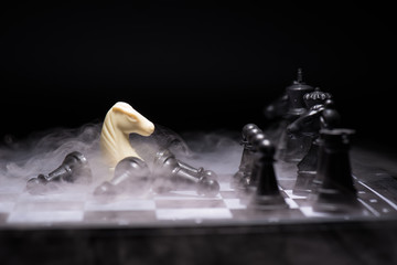 One  chess pieces staying against black chess pieces