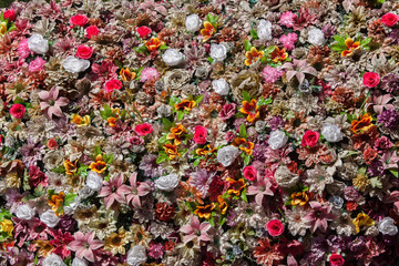 Plastic colourful flowers. Background texture
