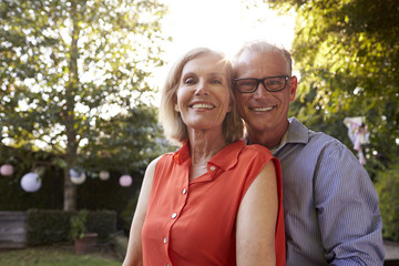 Fototapeta premium Portrait Of Loving Mature Couple In Back Yard Garden