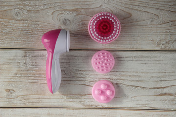 electric brush cleanser on a wooden white background