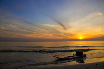 Kayak park by the sea at sunrise.