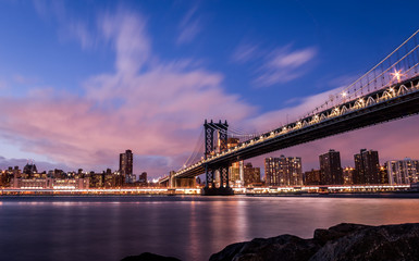 Manhattan Bridge and Manhattan Skyline at sunset - New York, USA
