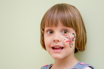 Little girl with flower face paint