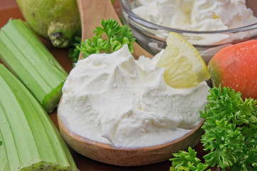 Sour cream closeup with fresh ingredients
