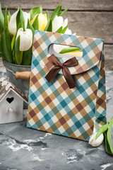 tulips, bird house and a gift package