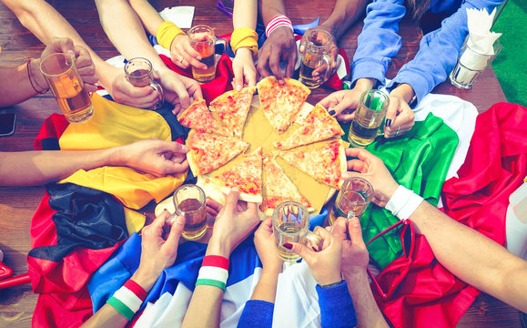Multicultural friends eating pizza margherita top view - Group of multiracial people different hands sharing food at sport event party above image  