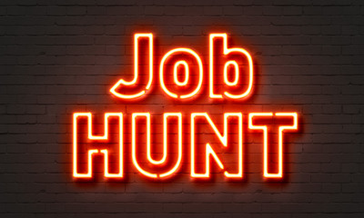 Fototapeta na wymiar Job hunt neon sign on brick wall background.