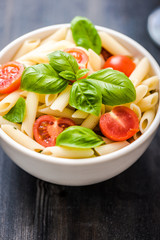 plate of penne pasta with tomato