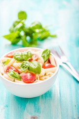 plate of penne pasta with tomato