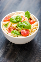 plate of penne pasta with tomato