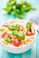 plate of penne pasta with tomato