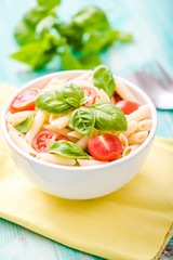 plate of penne pasta with tomato
