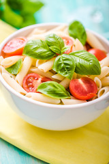 plate of penne pasta with tomato