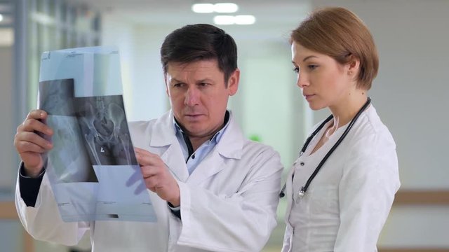 Doctors discussing x-ray image