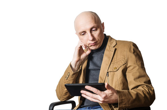 Middle-aged man with the tablet in his hands