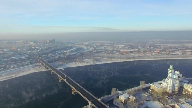 Aerial view from the air. Winter. Irkutsk city. Russia. Siberia. View of the bridge across the Angara River