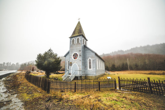 Coastal church in winter rain