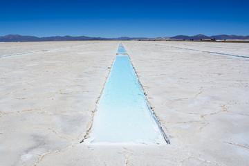 Salinas Grandes and ditch of water and salt
