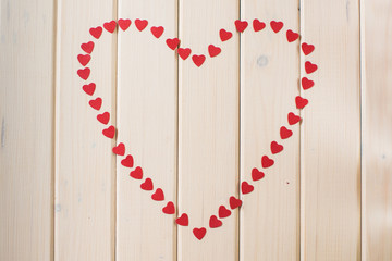 Mosaic of pomegranate grains in a heart shape.