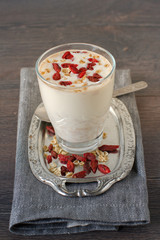 Homemade smoothie made from oats milk and goji beries