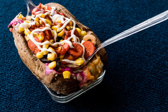 Kumpir / Turkish Baked potato with cheese, corn, sausage, ketchup and mayonnaise.