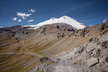 View to the Snow Covered Mountain Top with Blue Sky On Background