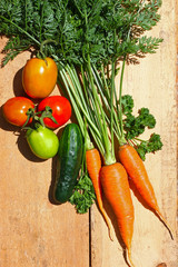 Fresh organic vegetables on wooden board