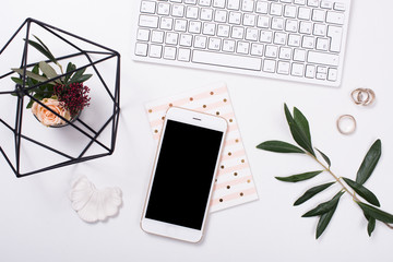  feminine tabletop flatlay with smartphone mock-up