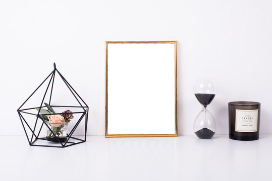 Golden frame mock-up on white wall