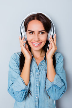 Portrait of beautiful happy smiling young woman with headphones
