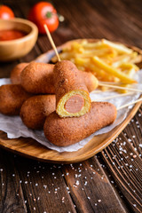 Homemade corn dogs with fries, ketchup and mustard