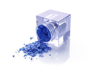 Jar of blue powder eyeshadow for makeup as sample of cosmetic product